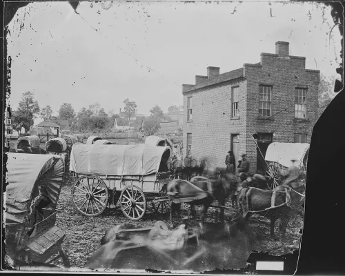 View of a Brick Building and Wagons #22